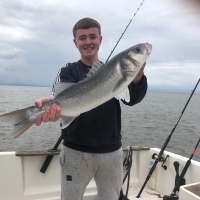 1 Owain lane 6lb7oz bass on private boat CEEJAY from CBYC at aberthaw on double squid bait