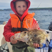 2 A very pleased Jack squance, Honiton club junior who caught this John Dory on thenfamily boat from Salcombe - the first trip after lock down