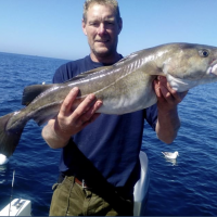 6 Glyn Carley with a decent cod caught on his own boat Freedom