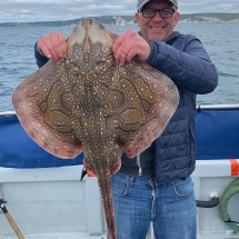  Steven Black and his 12lb undulate ray caught on 16th July was caught aboard Sally Ann Jo from Weymouth on a ledgered mackerel strip 