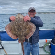 Steven Black with his 12lb undulate ray caught on Sally Ann Jo from Weymouth on a ledgered mackerel strip
